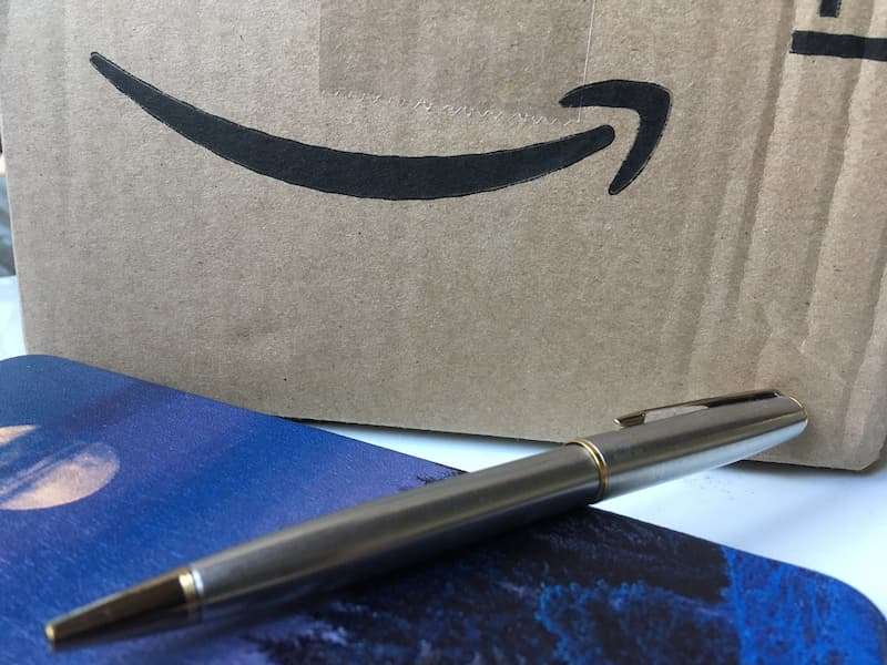Cardboard box with Amazon logo on the side